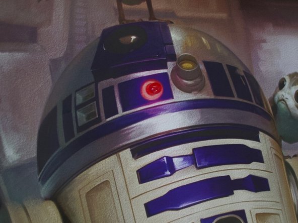 Tip: If you don't have a safety pin, make a horizontal slit in the poster with your craft knife and press both LED legs thought the slit.