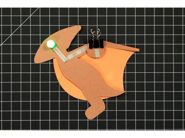 Use a binder clip to hold the battery in place.