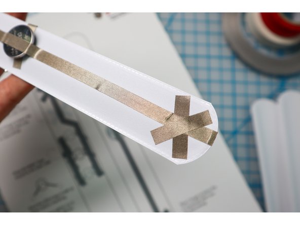 Add an X of Maker Tape to the inside of the bracelet as shown.