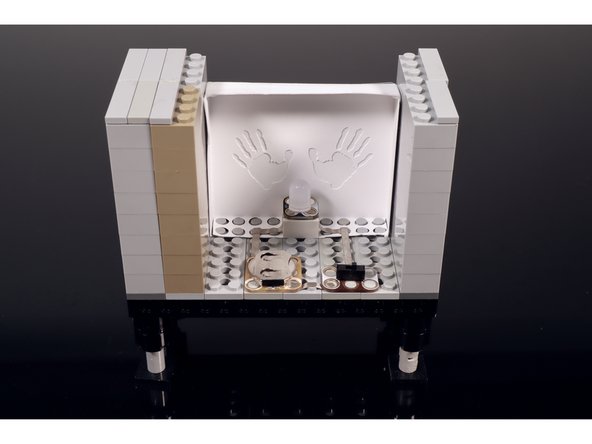 Build the two side walls of the TV and add a top and an antenna. You can always use the same parts that are shown but you can also improvise a different build if you don't have these same LEGOS.