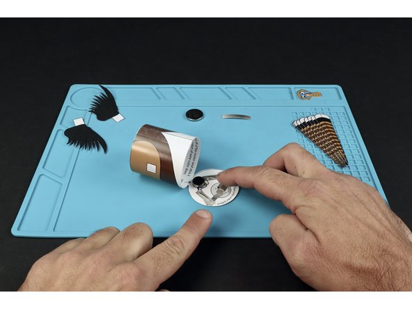 Stick the tape loop onto the end of the tape section that you last placed as shown.