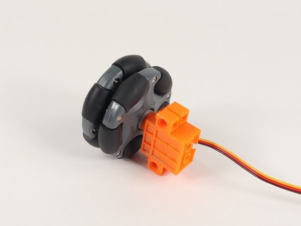 Alternately, you can use these LEGO compatible wheels, but the LEGO hub that comes with it doesn’t really work when attached to servos. (It works well for LEGO axles going all the way through and held in place, but not when put directly onto a short servo axle.)