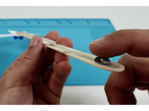 Stick that tape loop in place atop the far end of the long path from the previous step as shown.