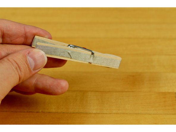 Go around the backside of the clothespin and to the bottom.