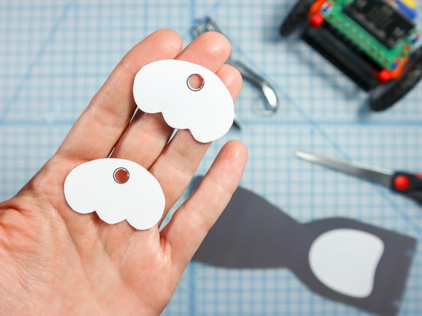 Use a standard hole punch to punch out the circled where shown.