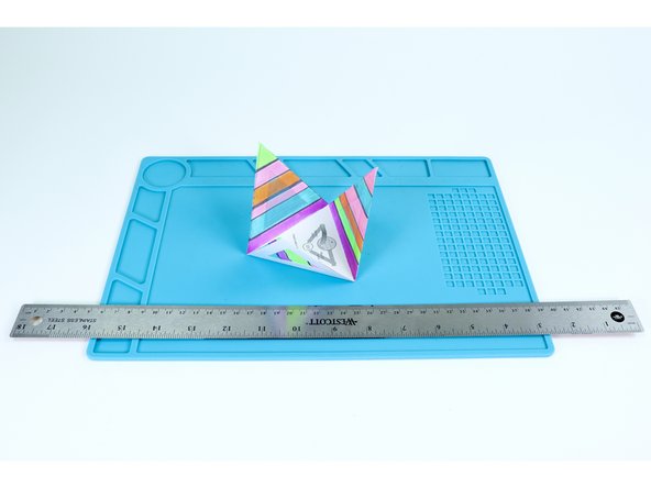 After each of the 3 colored panels have been added, use a ruler as shown in photo 1 to help you fold the sides in preparation for final assembly.  It is easier to do this now without having added the circuitry.