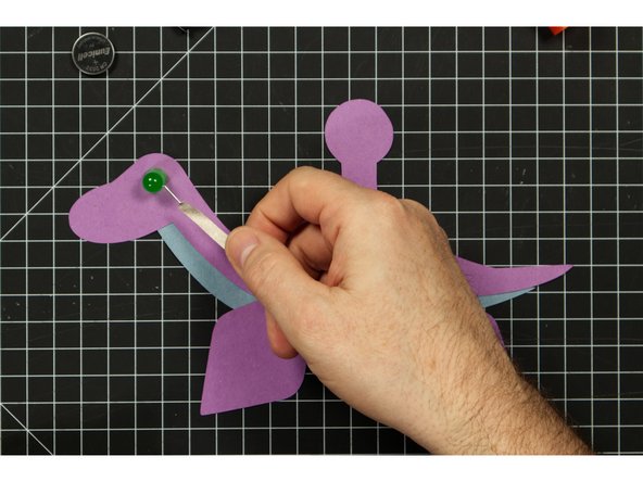 Run a piece of tape along the front of your Plesiosaurus, covering the negative LED leg.