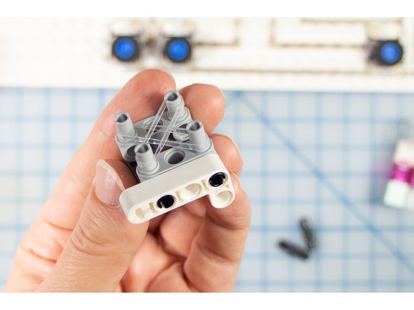 Optional: Add two small elastic bands (we used tiny hair ties) crossing the center of the box. This will help if you want to hold a smaller-barreled pen in place.