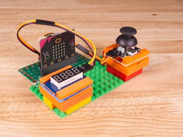 We used some 3D printed parts we designed to hold the Thumbstick and 7 Segment Display in place on a LEGO baseplate.
