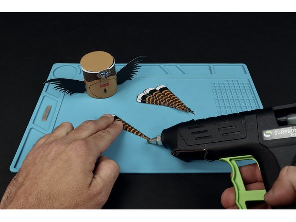 Use hot glue to add any included embellishments.