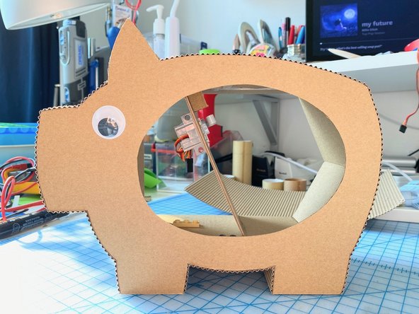 Here are some photos of the front and back of the pig once everything was glued in place. It's looking pretty good! :)
