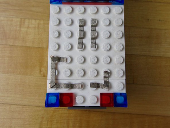 Use one line of tape to connect Hole 3 to an LED.