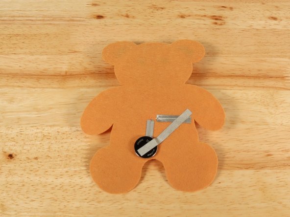 Add Maker Tape to connect the top (Positive) side of the battery to the Positive LED leg path.