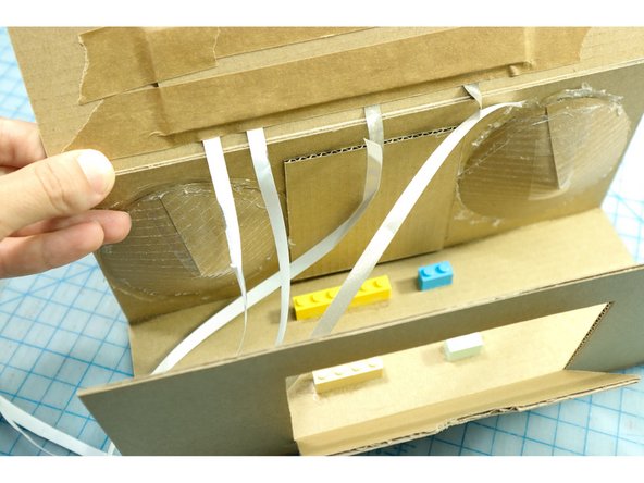 Slowly remove the backing from the Maker Tape and run the tape to pins 10, 13, and 14, respectively.