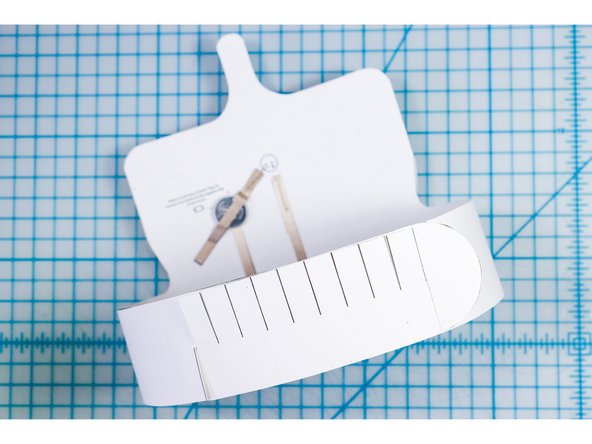 Interlock the slits in two places to create the size that works for your head.