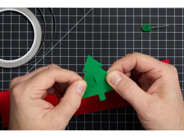 You can easily cut the slit with scissors by folding your shape in half then making a short cut. Start small and test it out, then make it longer if needed.