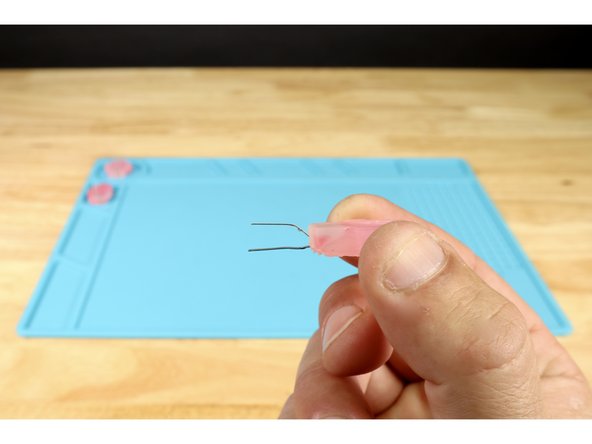 Bend the LED legs as shown in photo 1 so the short negative leg is oriented forward and the longer positive leg is behind it.