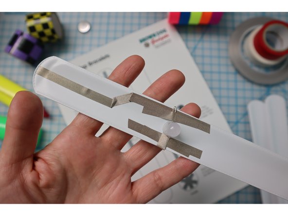 Add the LED(s) by folding the legs in half and attaching them with Maker Tape.