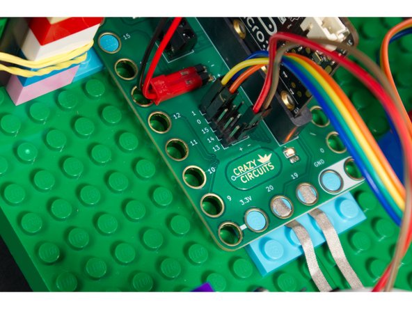 Connect the 7 Segment Display CLK to Pin 0 and DIO to Pin 1. And just the like the DS3231 module VCC and GND go to + (positive) and - (negative) pin headers so the Bit Board can power the module.
