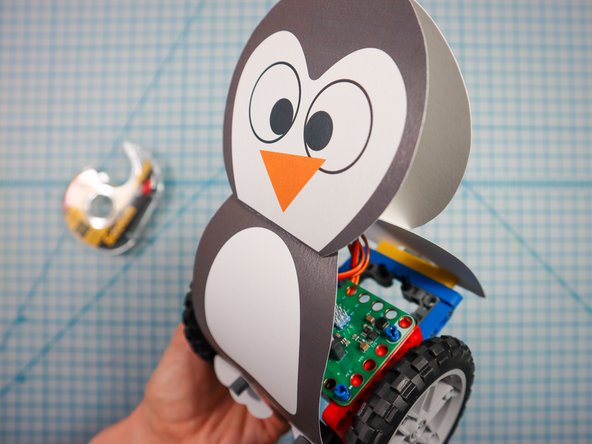 Adhere the head to the body as shown.