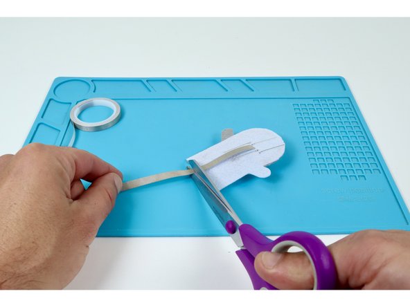 Cut 4 small pieces of 1/4&quot; Maker Tape that are about 2x the length of each LED leg.