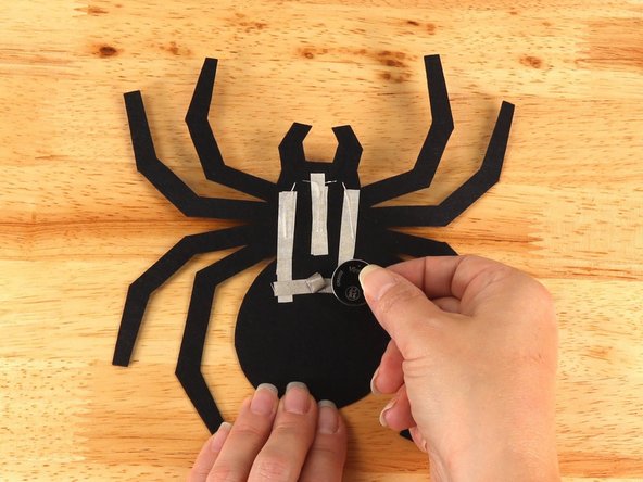 Make sure the Positive side of the Battery is facing upwards, with the Negative side stuck down to the tape.