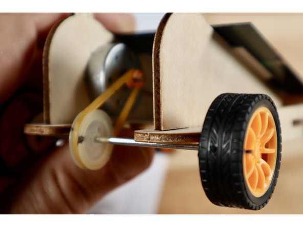 Return it to standard and mark dots on the orange pulley wheel, the white pulley wheel and the rim of the rear right wheel. Use these dots to help keep track of the number of rotations in the next investigation.