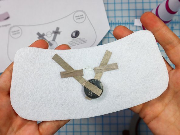 Place a piece of Maker Tape on top of each leg to make a secure connection.