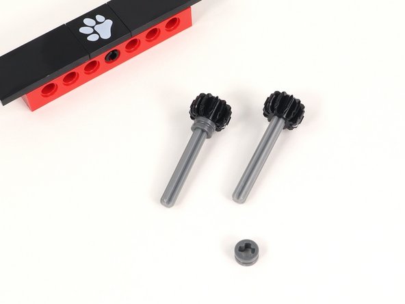 Add a half bushing to each axle and push it all the way down to the gear.