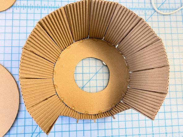 We cut a 2-inch circle in the top to allow the gumball to pass through.