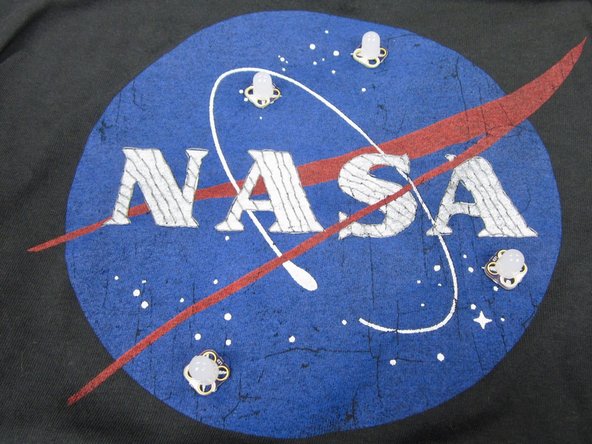 Use standard thread to sew the LEDs down.