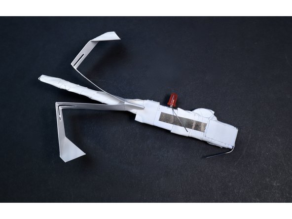 Use the two tape pieces to cinch together the sides of the Rotor Blade around the narrow shaft.