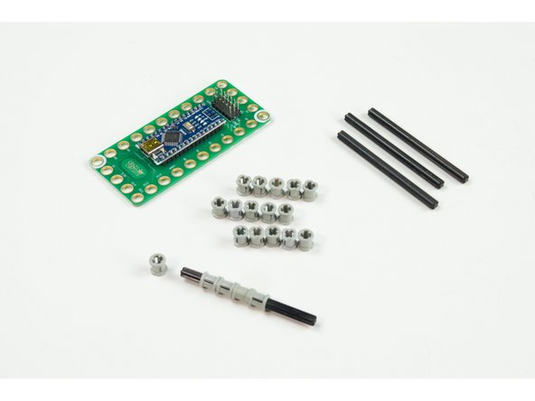 Slide 4 of the LEGO Bushing parts onto each LEGO Axle 8.