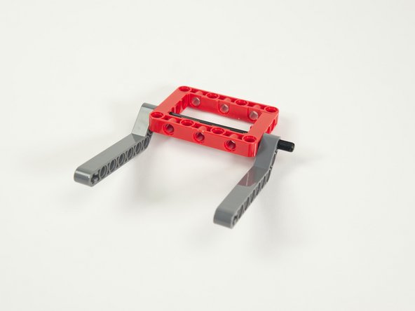 Note that the axle should stick out from the second beam, as this is where we'll add the large gear in Step 9.