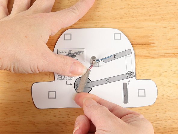 Add another piece of Maker Tape to  Tape Path A. pressing it down atop the red wire.