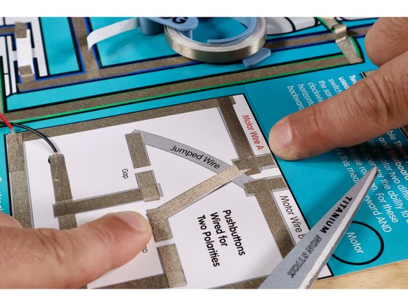 Measure, cut, peel, and stick the Maker Tape segments of the lower part of the criss-cross as shown. Take care to maintain the pictured gap.