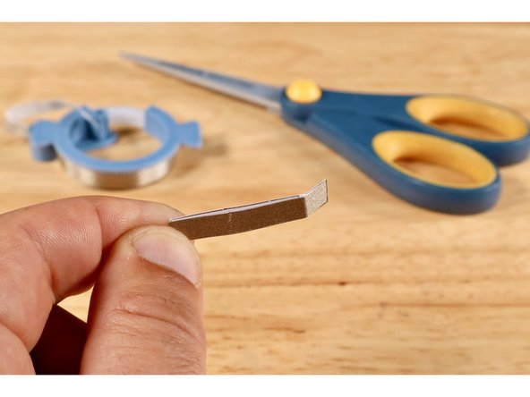 Measure, cut, peel, and stick a piece of Maker Tape where shown on the switch template.