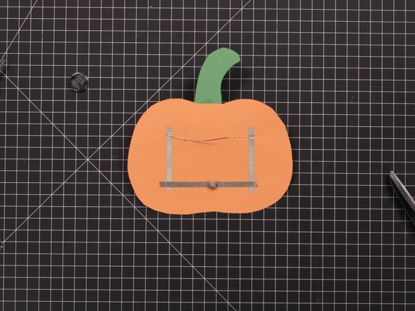 Use a binder clip or paper clip to hold the battery holder together.