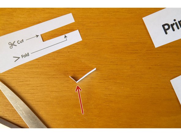 Take your switch and fold it about 90 degrees where indicated with the fold line, and attach a piece of conductive Maker Tape to the switch.