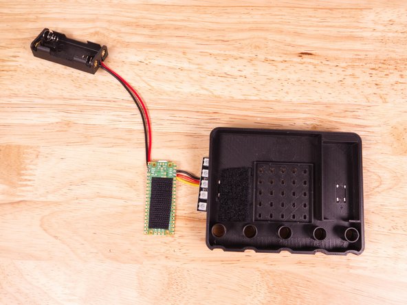 We also trimmed down the hook piece and stuck it to the back of the Pi Pico microcontroller so we can stick it down to the loop piece.