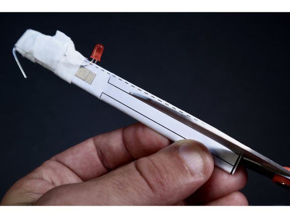 With a scissors, carefully trim along the template lines leaving you with a frilly, narrower section.