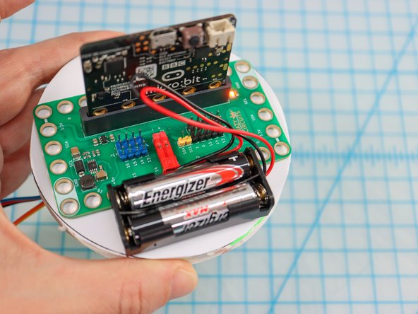 Stack the circles on top of each other, aligning the 4 circles in the center. (There is a right and wrong way, rotate 90 degrees if it doesn't align perfectly).