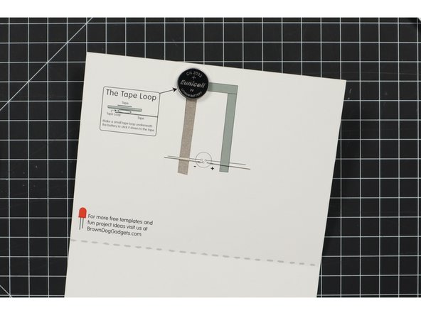 Once you've got your tape loop in place stick the battery to it, negative side down.