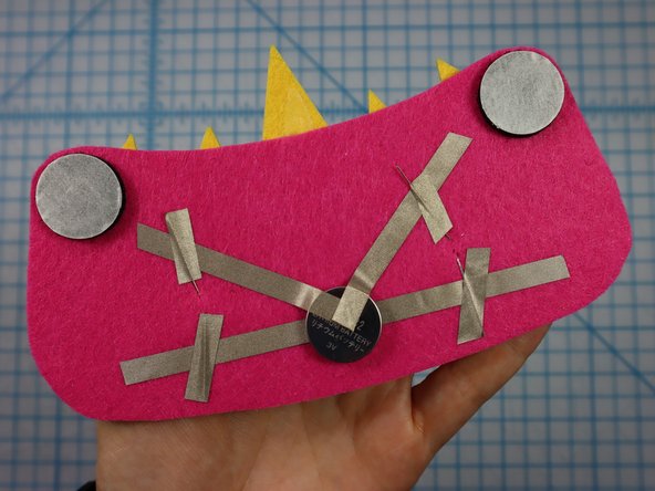 Peel the paper backing off of each hook and loop dot and place it where shown on the template.