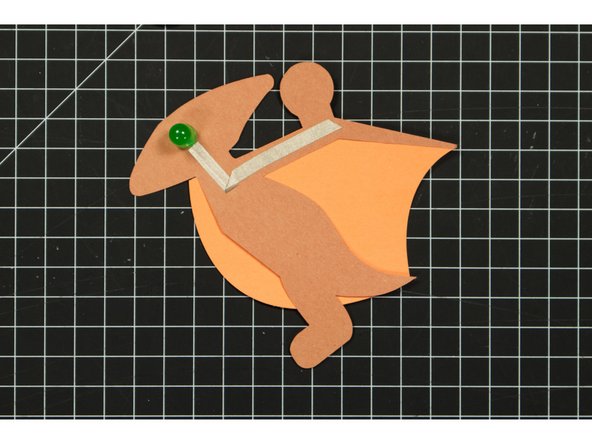 Run a piece of tape along the front of your Pterodactyl, covering the negative LED leg.