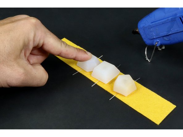 Repeat this process for the remaining two LED jewels taking care to keep all short LED legs on one side of the felt and all the long legs on the opposite side.  