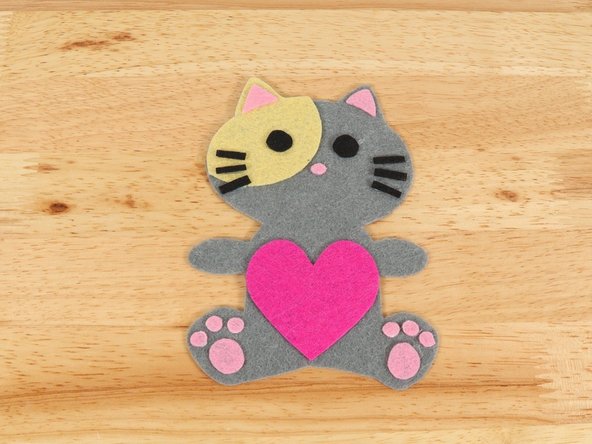 Regular Elmers glue and Tacky glue both work well, but you will need to give the Cat time to dry overnight before adding the circuit. Hot glue also works well and dries fast so you can build the circuit right away.