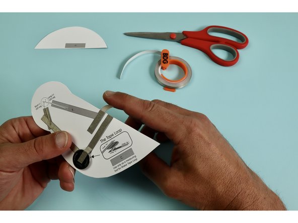 Measure, cut, peel, and stick a piece of Maker Tape down as indicated atop the letter 'E.'