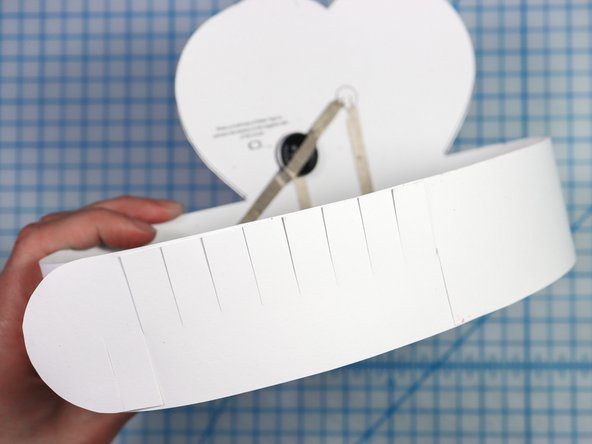 Interlock the slits in two places to create the size that works for your head.