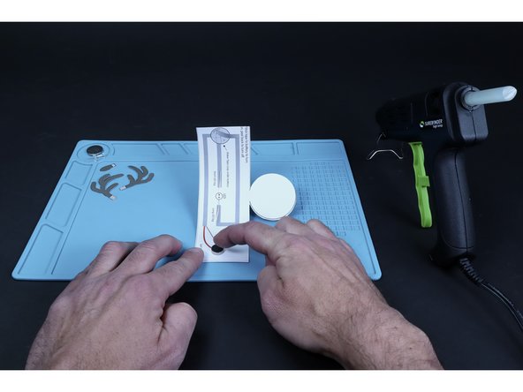 Peel and stick the vibrating motor where shown on the diagram.